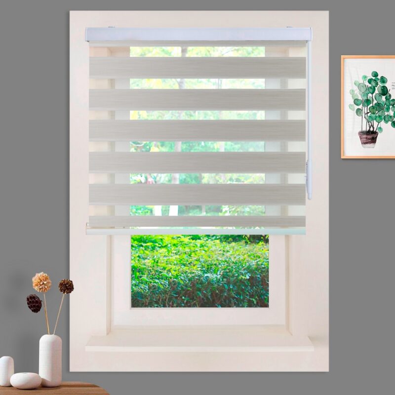 a window with a white shade and a picture on the wall